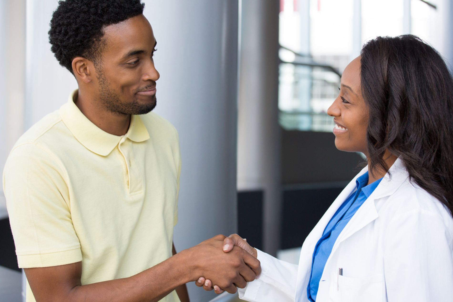 Medical doctor shaking the hand of a patient.